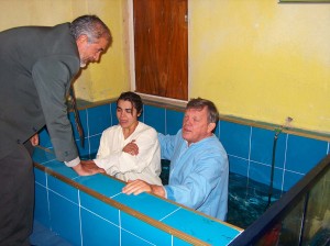 Carl baptizing an believer at John's church
